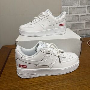 Nike White Low-Top Sneakers with Red Logo